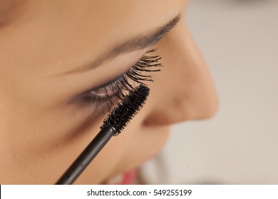 Young Woman Applied Mascara To Her Lashes