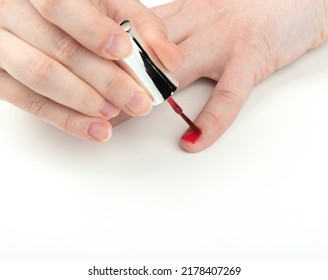 Young Woman Applies Polish On Her Pinky Nail. Manicure At Home.