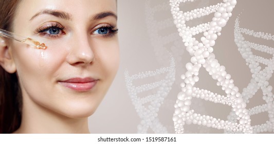 Young Woman Applying Primer Oil On Face Among Bubble DNA Stems. Beauty Science Concept.