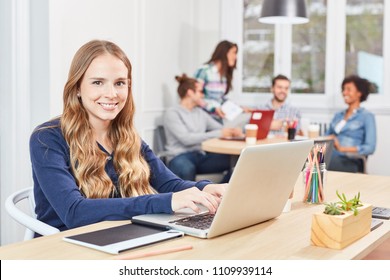 Young Woman As Apprentice Or Trainee Working On Laptop In An Office Community