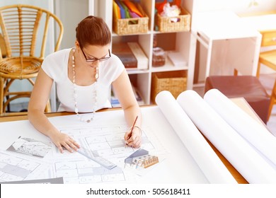 Young Woman Architect In Office