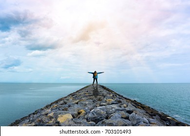 Young Woman With Arms Raised In The Sky With Sunlight ,Winner Success Concept, Freedom Concept