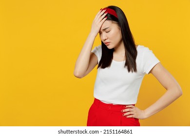 Young woman of Asian ethnicity 20s wears white t-shirt put hand on face facepalm epic fail mistaken omg gesture isolated on plain yellow background studio portrait. People emotions lifestyle concept - Shutterstock ID 2151164861