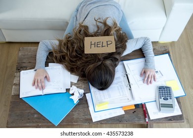 Young Woman Asking For Help Suffering Stress Doing Domestic Accounting Paperwork Bills And Invoices Worried And Stressed At Home Sofa Couch With Laptop Laptop And Bank Folders