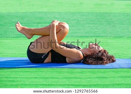 Similar – Young black woman doing stretching after running outdoors