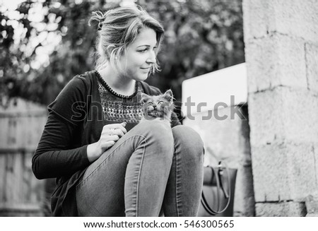 Similar – Cat legs and human legs on sun deck