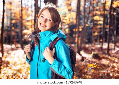 Young Woman With Backpack Hiking. Fall