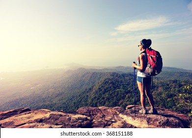 Young Woman Backpacker Enjoy The View At Seaside Mountain Peak