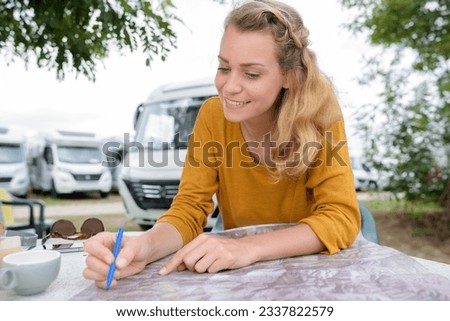 Similar – Image, Stock Photo Young women looking road map with 4×4 on background