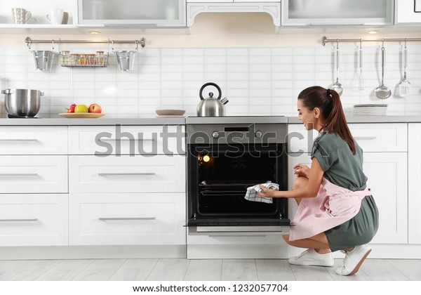 Young Woman Baking Something Oven Home Stock Photo 1232057704 ...