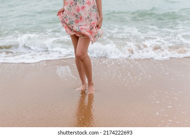 Young Woman Barefoot Walking On The Sand Beach.