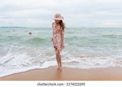 Young Woman Barefoot Walking On The Sand Beach.