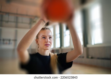 Young Woman Basketball Player In Gym, Throwing Ball In Basket..