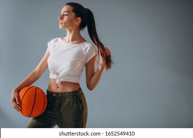 Young Woman Basketball Player Isolated At Studio