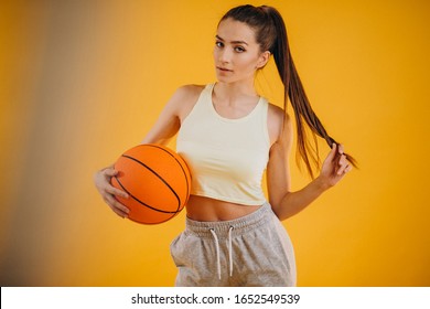 Young Woman Basketball Player Isolated At Studio