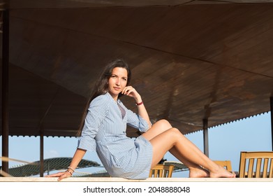 Young Woman Basking In The Sun.