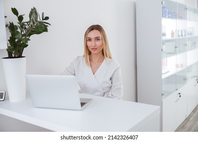 Young woman beautician using notebook at work - Shutterstock ID 2142326407