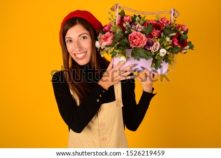 young woman with beautiful flowers in hands floristry autumn isolated background