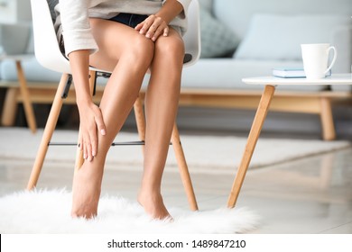 Young Woman With Beautiful Legs At Home