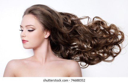 Young Woman With Beautiful Long Curly Hair - White Background