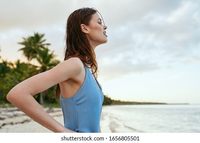 young woman in a beautiful swimsuit on the beach - Shutterstock ID 1656805501