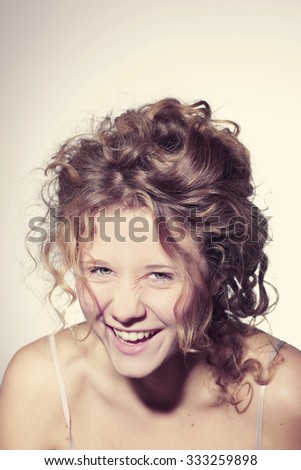 Similar – Young happy woman sticking out her tongue