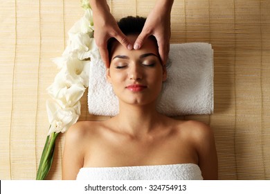 Young Woman In Beauty Spa Salon Enjoying Head Massage