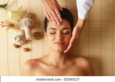 Young Woman In Beauty Spa Salon Enjoying Head Massage