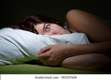 Young Woman In Bed  Eyes Opened Suffering Insomnia. Nightmare Issues