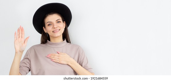 Young Woman In Beige T-shirt Making A Promise. I Swear To Tell Only Truth