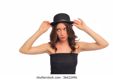 A Young Woman Being Silly With A Derby Hat On A White Background