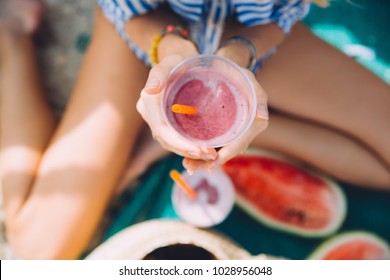 Young Woman With Berry Smoothie On The Beach