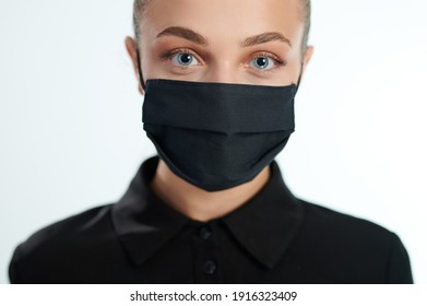 Young Woman In Black Face Mask Close Up View Isolated On White Background