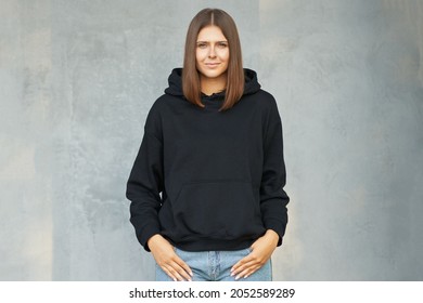 Young Woman In Black Hoodie.