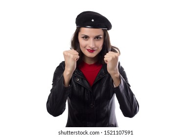 Young woman black jacket, red sweater and hat with a reference to revolutionary enthusiasm looking in camera, demonstrate her fists and smile on a white background