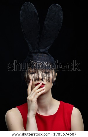 Similar – Young woman wearing rabbit ears and kissing