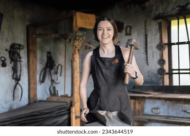 Young woman blacksmith portrait workshop - Powered by Shutterstock