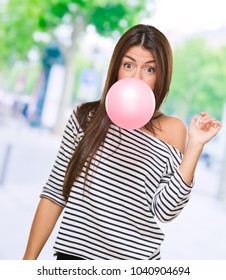 Young Woman Blowing Bubblegum, Outdoor