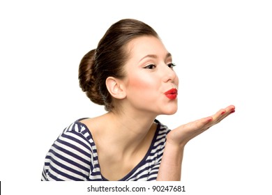 Young woman blowing a kiss