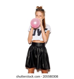 Young Woman Blowing A Pink Balloon . White Background, Not Isolated