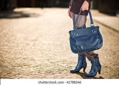 Young Woman With Blue Handbag And Shoes