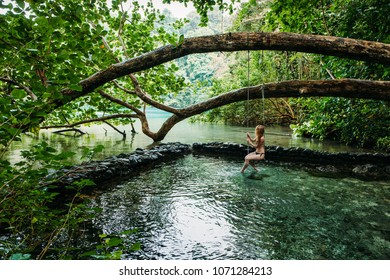 A Young Woman In Blue Lagoon In Jamaica