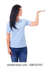 Young Woman In Blue Polo Shirt Showing Empty Copyspace