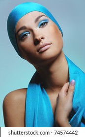 Young Woman In Blue Scarf  On The Head With Health Skin Of Face