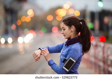 Young woman in blue sweatshirt running in the city - Powered by Shutterstock