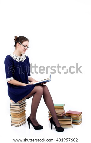 Young woman with books pile isolated on white