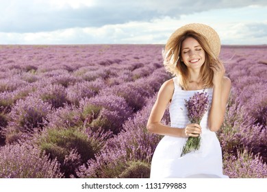 Young Woman With Bouquet In Lavender Field