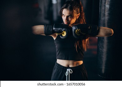 Young Woman Boxer Training At The Gym