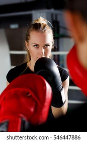 Young Woman In Boxing Gloves