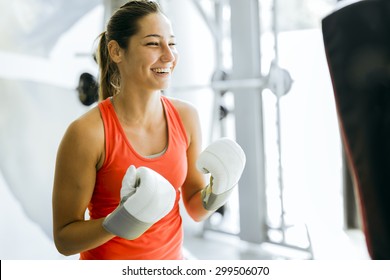 Young Woman Boxing And Training In A Gym